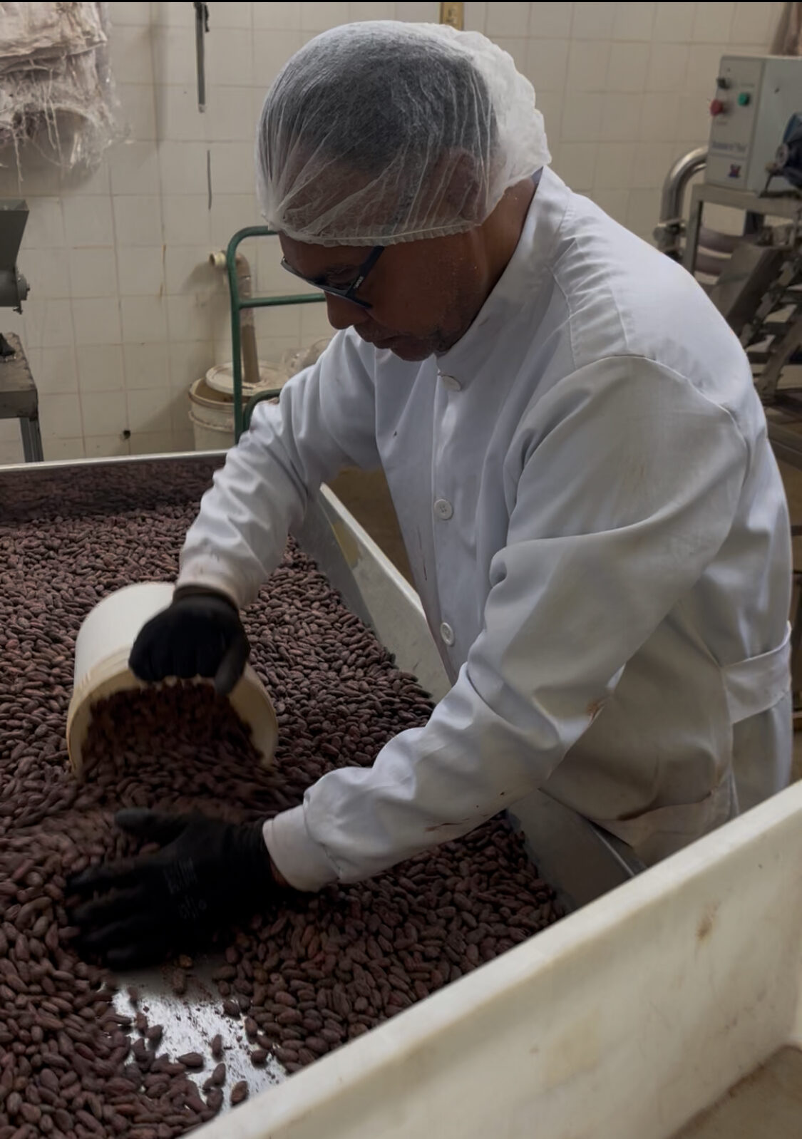Santos processing cacao beans at his Itabuna facility