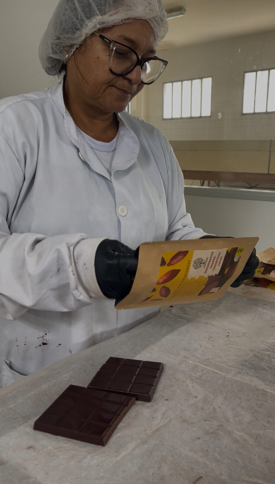 Santos's wife packaging finished Agroverse-branded chocolate bars