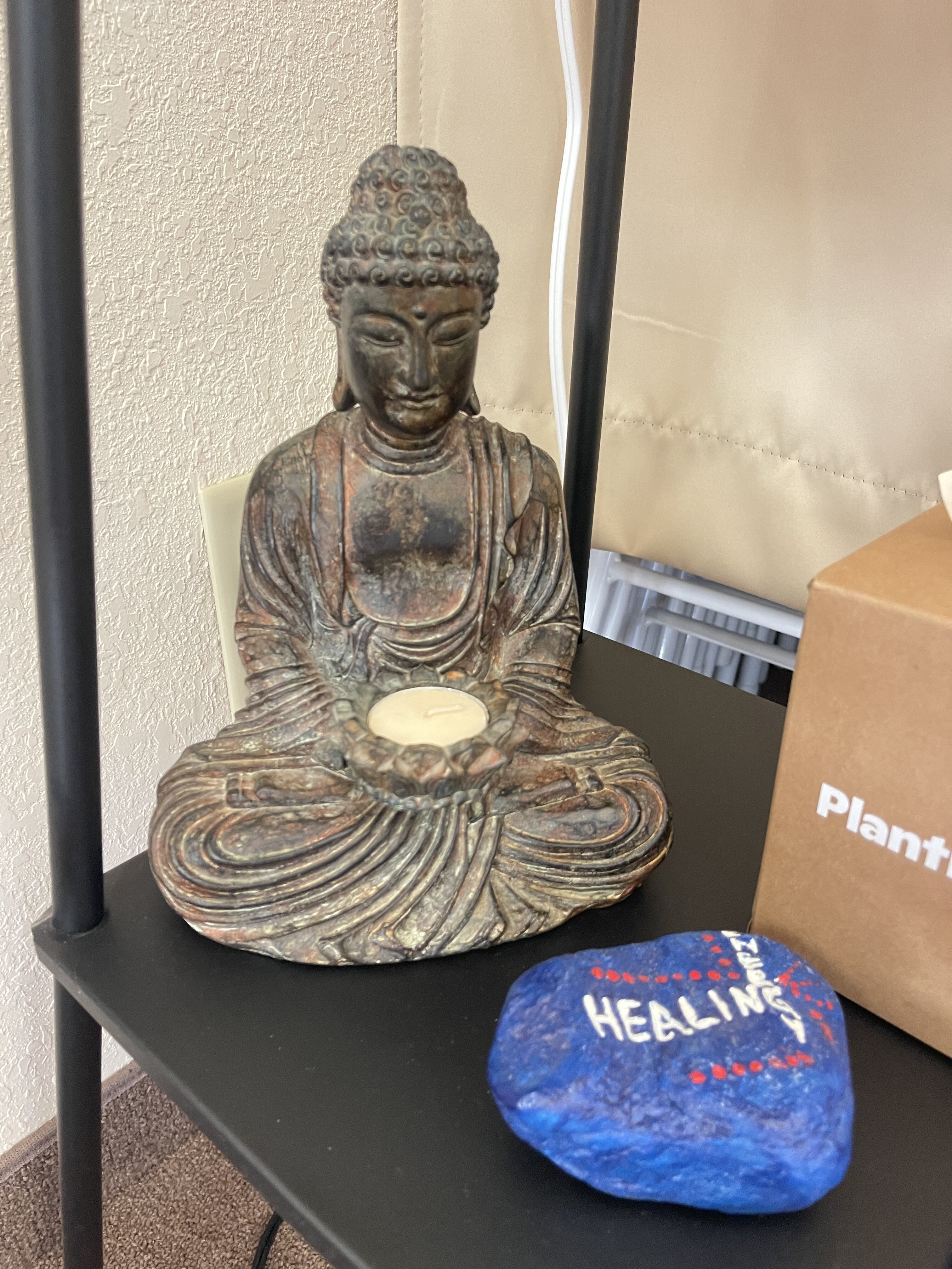 Buddha statue and healing heart at The Whole Body Repair Clinic