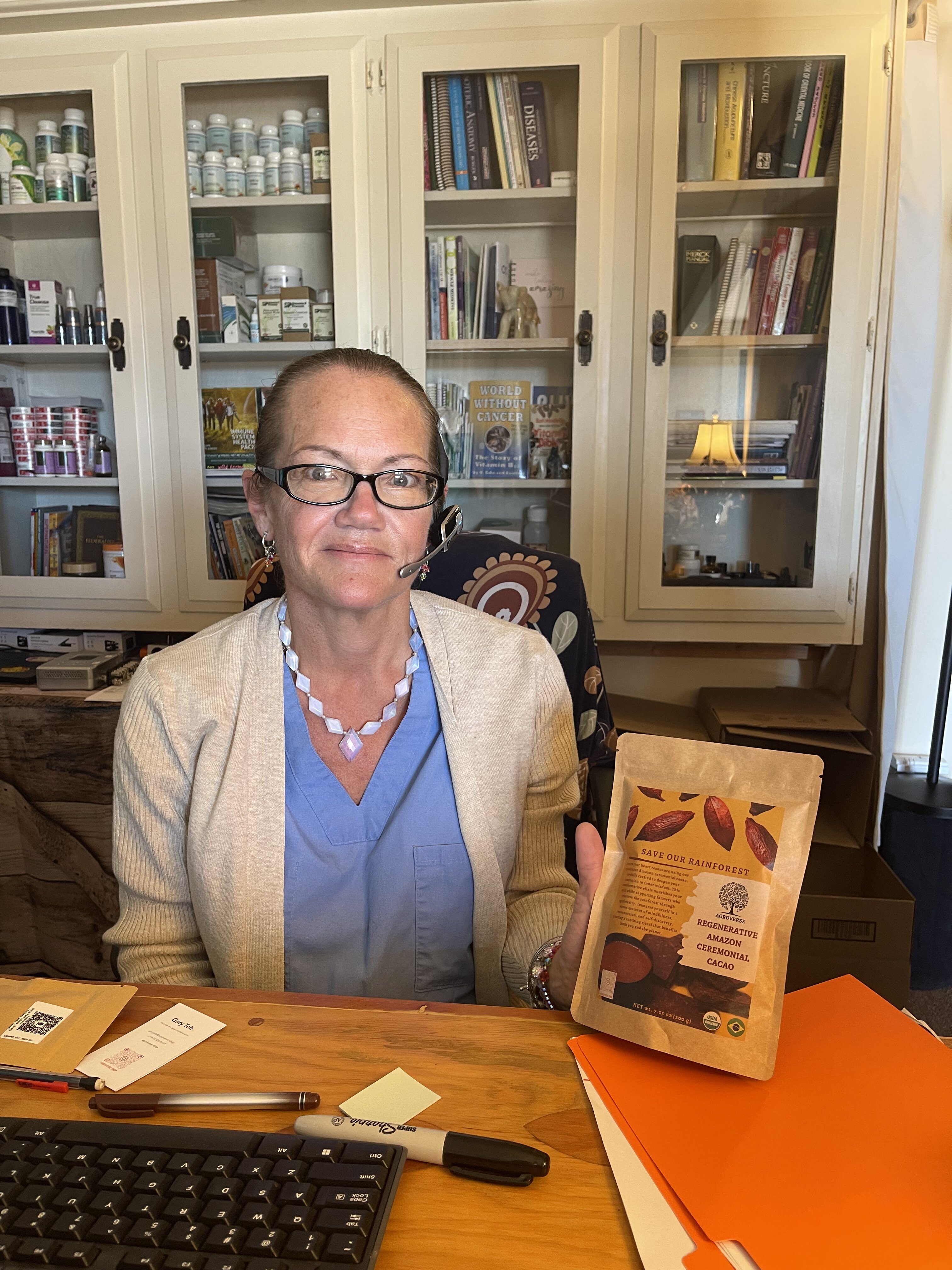 Andrea holding ceremonial cacao at The Whole Body Repair Clinic